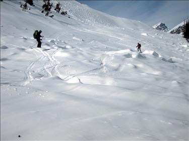 Crossing avalanche debris above mosquito creek at end of Dolomite Circuit