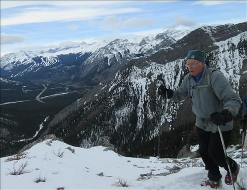 Philip bracing against the wind on the ridge