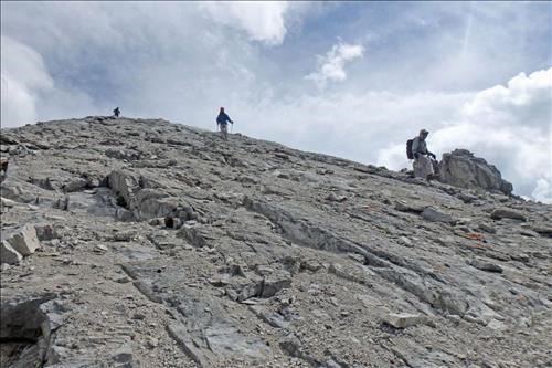 Descending the slabs near the summit of Mt Lawrence Grassi