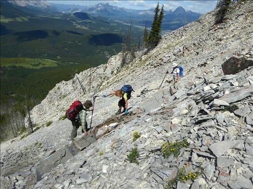 Bill helping Ginger across loose rock.