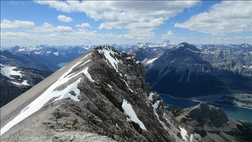 The summit ridge with Mount Assiniboine in the distance
