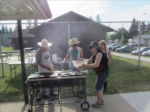 Stampede breakfast 2017, the pancake cookers: {162 Peter Fischer}, {952 Ginger Bradley}, {215 Anita O} and Quality Control Supervisor, {206 Barb Mitchell}