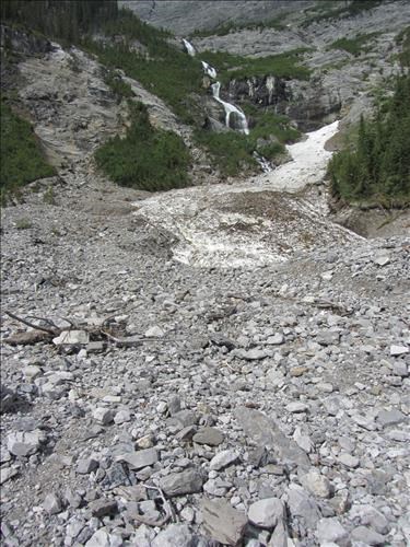 Waterfall and avalanche remnant with 2013 flood debris