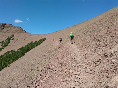 Peter and Rejeanne approaching the col.