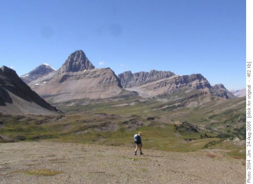 Christine hikes through the meadows to the west of Brachiopod and Anthozoan Mountains.