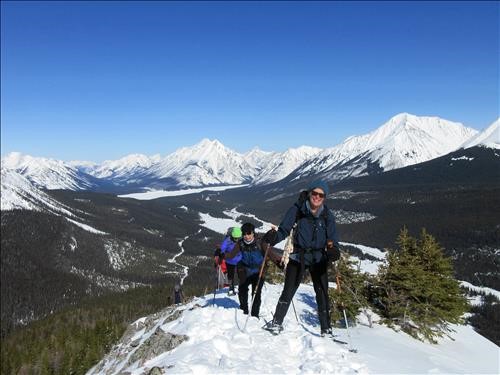 Susan and Yoko reach the high point with Spray Lake in the background