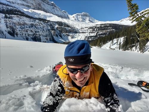 Cornelis digging out of a snowbank along the shore of Boom Lake's Island