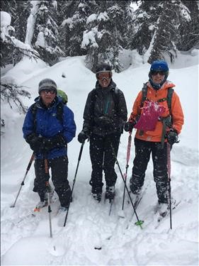 {1456 Clifton Potter}, {1063 Inge Stolz}, and {172 Christine Grotefeld} enjoying the quick ski out in fresh powder.