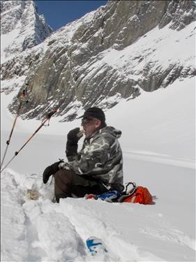 Carl enjoying a well-earned lunch:French-Haig-Robertson traverse.