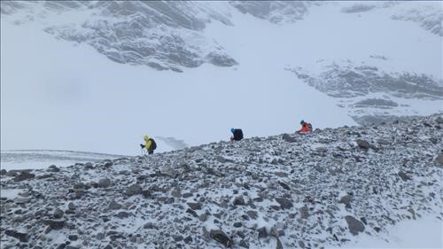 Crossing lateral moraine to French glacier