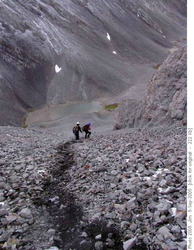 Gary and Susan start their descent down the scree with Rummel Lakes below.