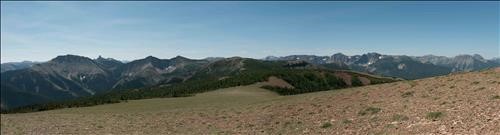 View across Table Mt from its Eastern Summit onto Castle Peak in the South, to Table Mt's lower Western Summit and the Front Ranges beyond.