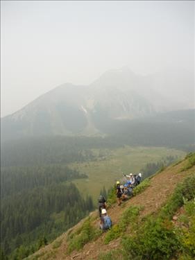 Ramblers rest on descent from Mt. Chester south ridge (note Chester meadows and Mt. Galatea? obscured by BC smoke)