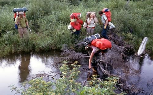 Dick Millar, Daphne Smith, Elaine McKennirey, Michael Crouch, Roger Woodgate - crossing beaver dam, Glacier USA 1972