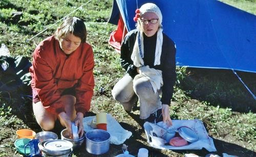 Roger Woodgate and Elaine Crummy doing dishes, Glacier USA 1972 