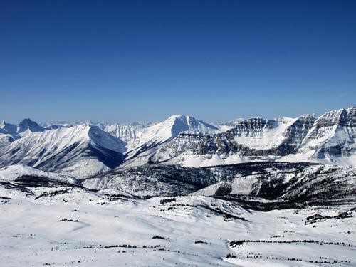 A warm blue sky spring skiing day at Sunshine