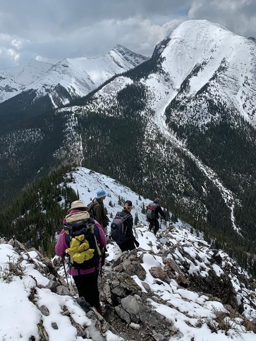 Heading down the slippery slope. Midnight Peak (right) & Half-past Midnight Peak (centre) in distance