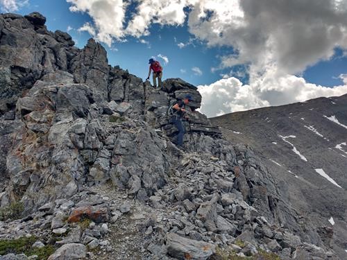 Easy scrambling descending east ridge Mount Howard - {1901 Suz Cor} and {1501 Bru Rams}