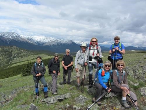 On top of Powderface: Quick! It's sunny! take the picture! Deb, Clifton, Mel, Philip, Cristina, Teresa. Seated:: Barb & Ginger