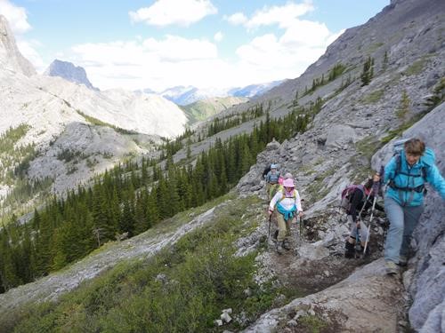 On the trail to Windtower looking back at West Wind Pass: Barb (in blue) is on one of the few minor scramble ledges