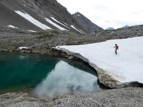 Suzy crossing over the second tarn on the way back.