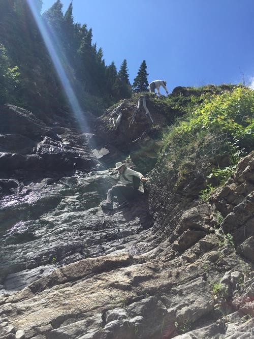 Scrambling down adjacent the waterfall