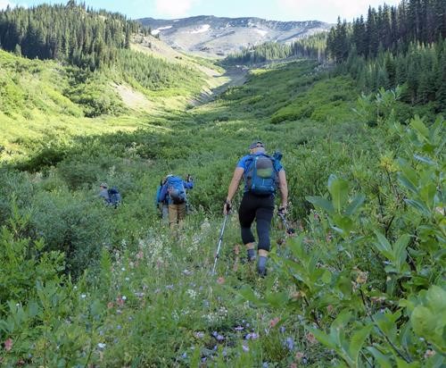 Ascending the avalanche gully, we veered right and slogged up the scree.