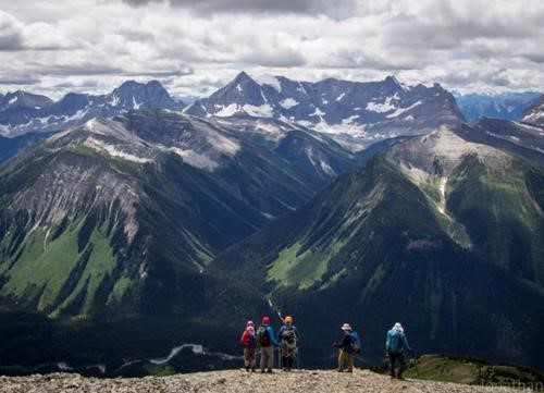 Sizing up the scree run on the summit crest. Photo by Jonathan Chui.