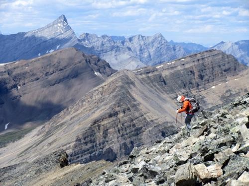 {168 si gal} descends the talus of south Mt. Kidd (Mt. Galatea in the top left)