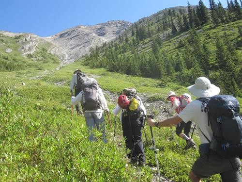 Ramblers ascend the lower drainage to south Mt. Kidd