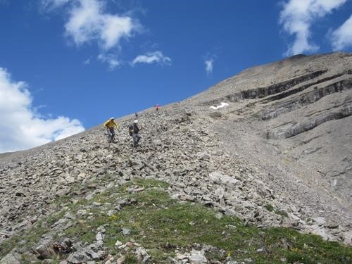 Ramblers descend the ugly talus on the direct route to south Mt.Kidd
