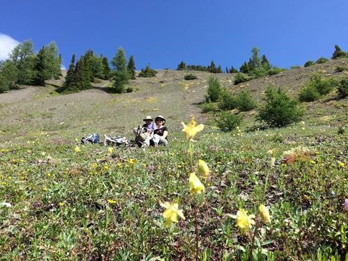 Relaxing at the bottom of the final scree run down from Lipalian