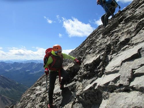 Alda and Bruce scrambling back down the steep slabs below the summit