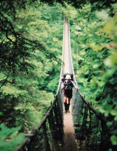 {152 ro ca} crosses a bridge on the West Coast Trail, BC