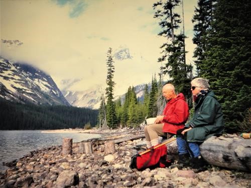 {265 alistair desmoulins} and {314 gail desmoulins} enjoy lunch by the Athabasca River enrote to Fortress Lake
