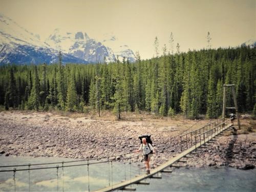 {265 alistair desmoulins} crosses the Athabasca River by swing bridge near Fortress Lake