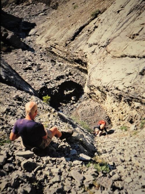 Alistair assists Gail up a difficult section to a 8838 feet peak near the Ram River Alistair assists Gail up a difficult section to a 8838 feet peak near the Ram River