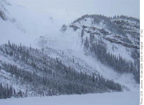 An avalanche roars down the slopes of Mount Ogden on the west side of Sherbrooke Lake.