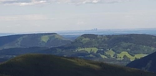 City skyline beyond the two Mesa Buttes (Square to left, Death's Head to right