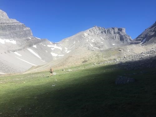 Peter leaving morning shade en route to the col