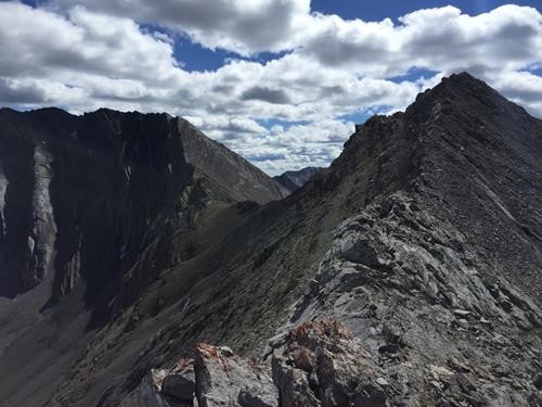Upper section of ridge showing col and optional higher peak extension to left