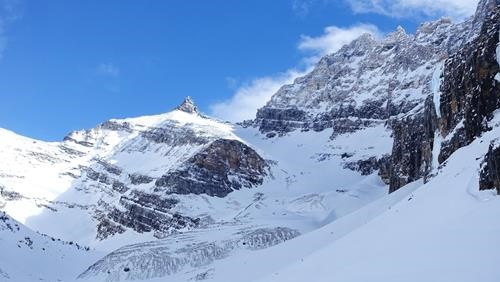 Storm Mt S is the col in the centre of the picture. The route follows the moraine which is void of snow.