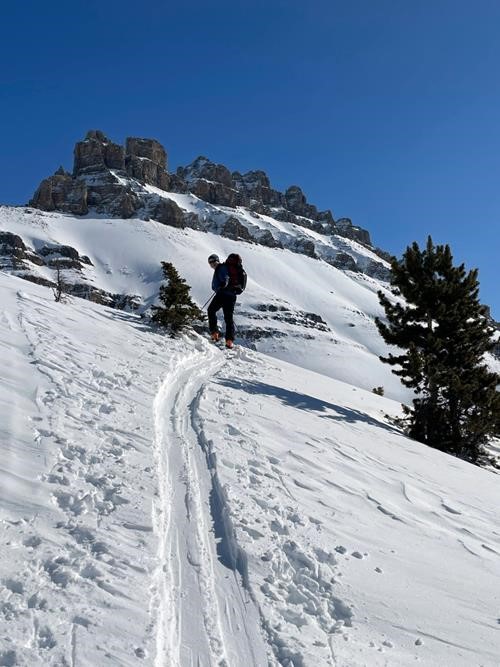 Bill with Dolomite Peak in background. Note wind effect on this west facing slope.