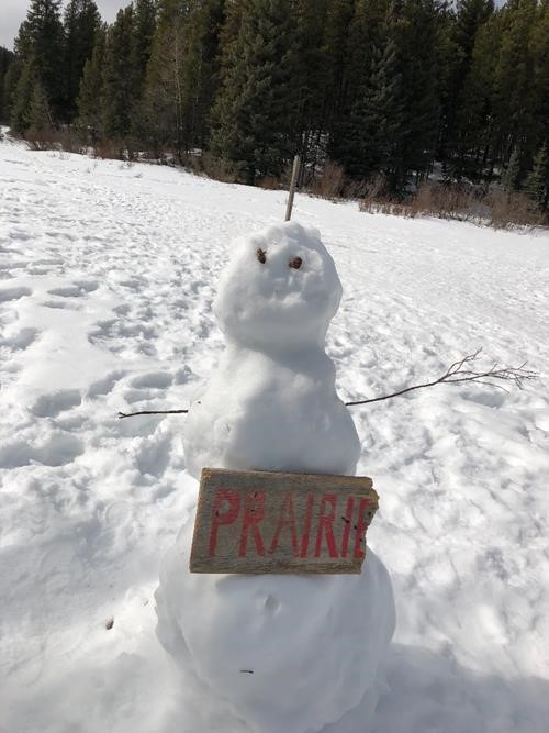 A snowman, sorry snowperson, at the junction with Powderface Trail 