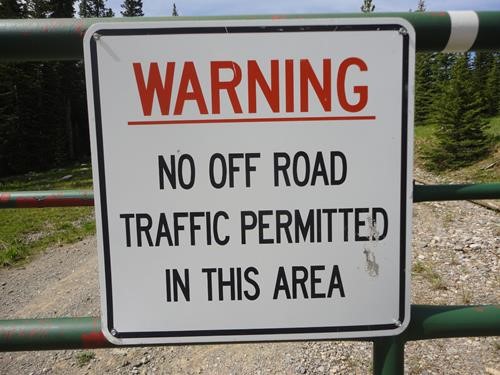 Sign at first gate on the plateau mountain road at Wilkinson summit on road 940