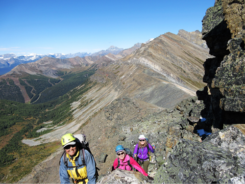 Susan, Sonja and Phyllis scrambling near the summit of Unity Peak