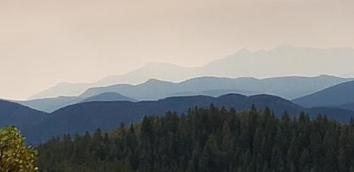 The great smoky Rocky Mountains create artistic blue ridges