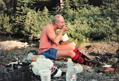 {265 Alistair Desmoulins} enjoys his meal while backpacking on the Great Divide Trail