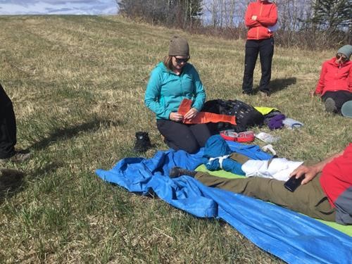 Back Country Emergencies Course by Rocky Mountain Adventure Medicine: Instructor Jenn prepares a sam-splint to stabalize a broken leg.