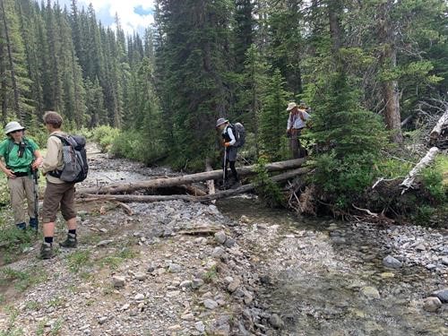 Crossing creek on Belmore Browne access trail